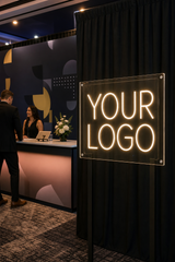 Custom LED neon sign used at a corporate event entrance and registration area