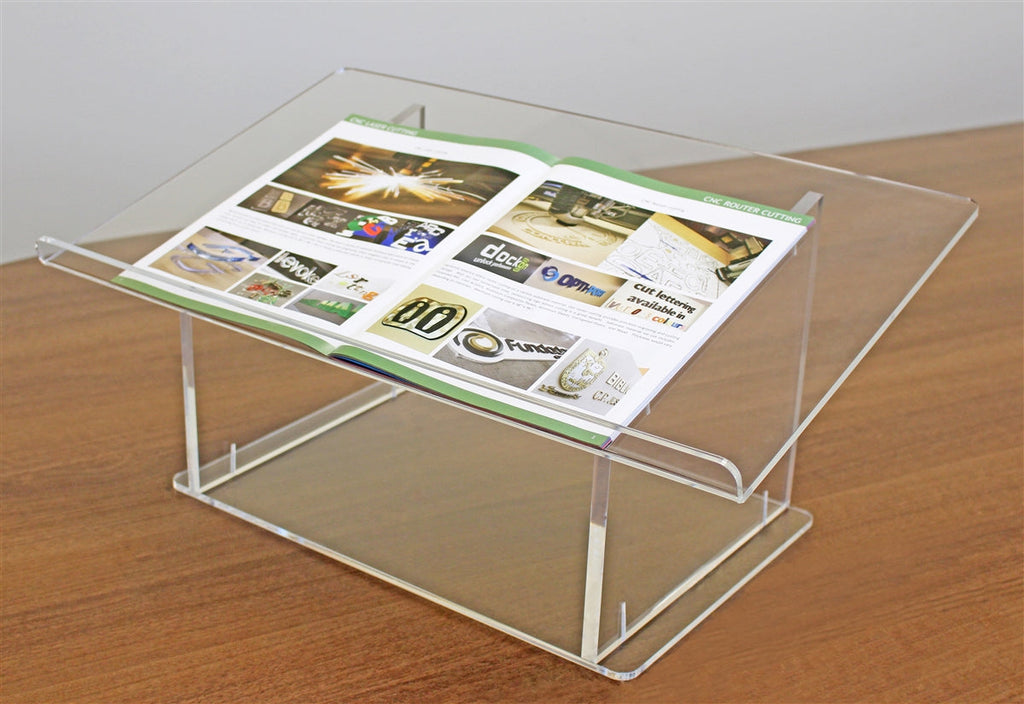 Clear acrylic tabletop podium holding a brochure