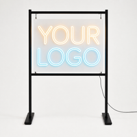 Custom LED neon sign product photo on clear acrylic with freestanding event display stand